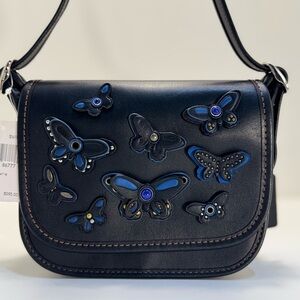 COACH Black Bag with Blue and Gold Butterfly Accents